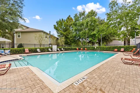 a view of swimming pool with lounge chair