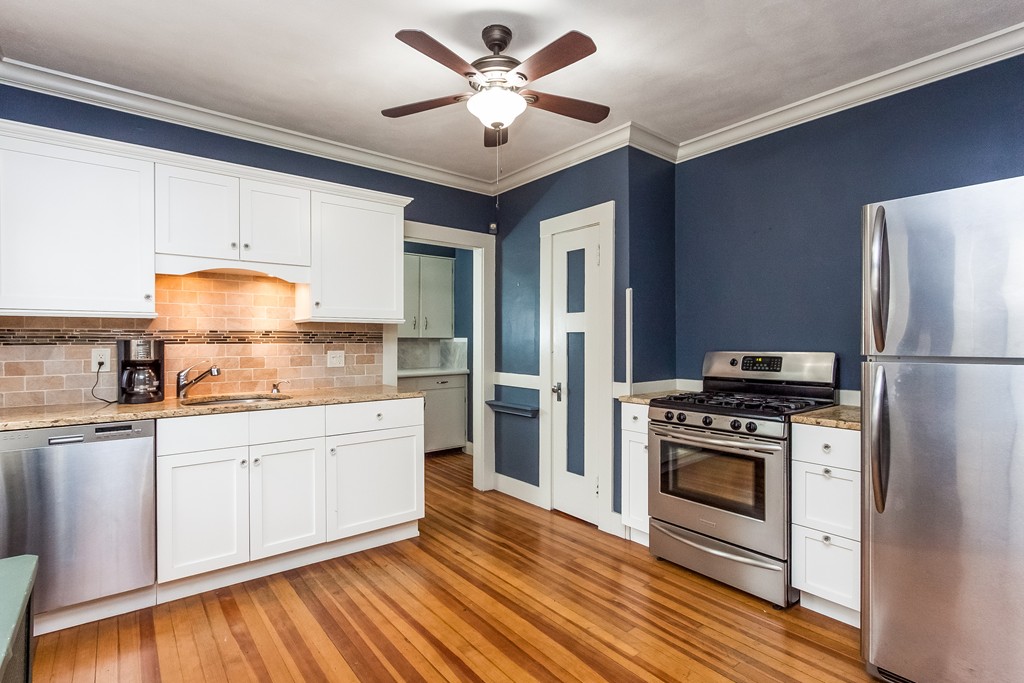 8 Riverview Terrace Springfield, MA 01108 - Photo 11 of 24 a kitchen with a stove refrigerator and a sink