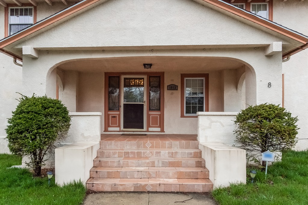 8 Riverview Terrace Springfield, MA 01108 - Photo 3 of 24 a front view of a house with potted plants