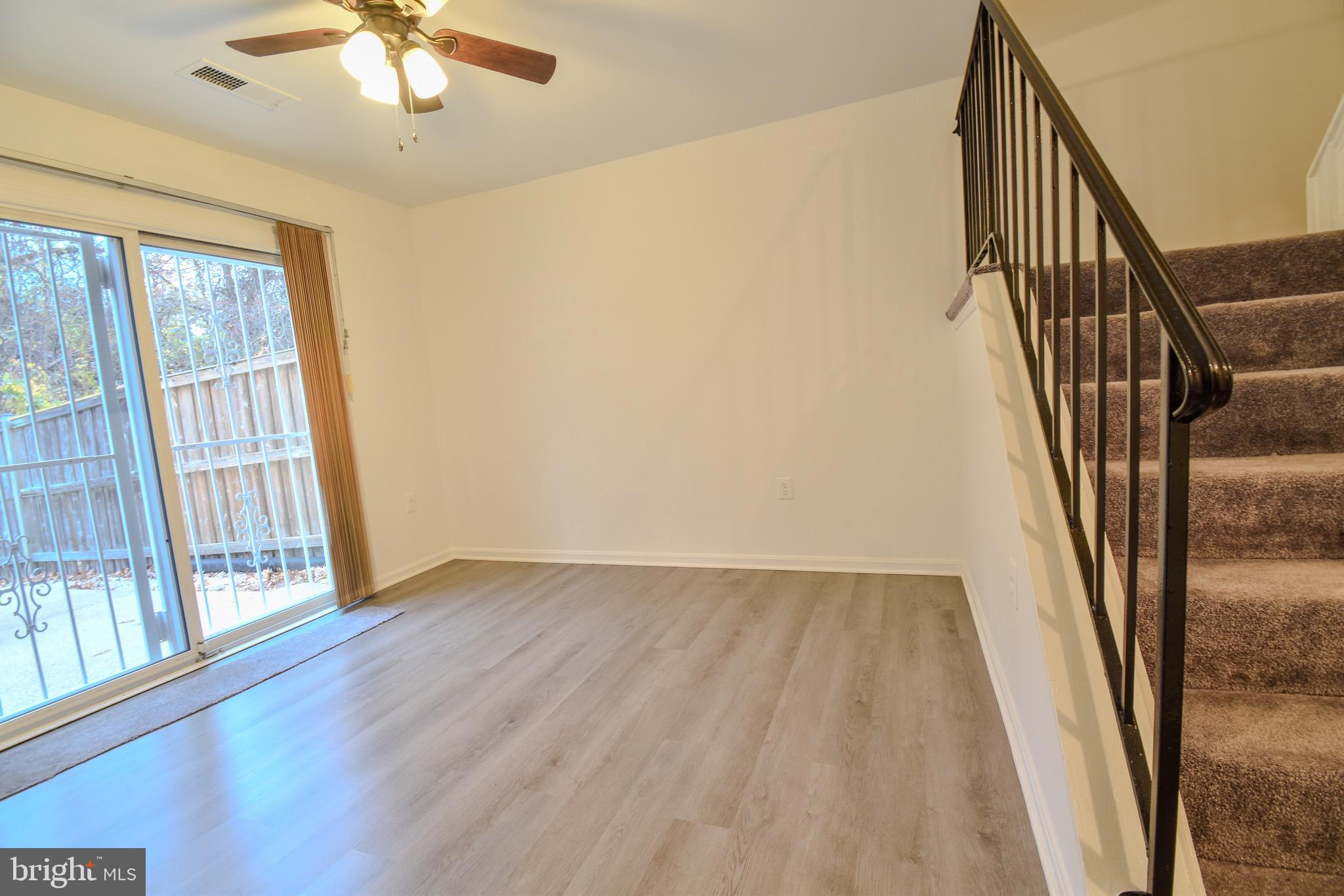 7730 Merrick Lane Landover, MD 20785 - Photo 14 of 19 wooden floor in an empty room with a window