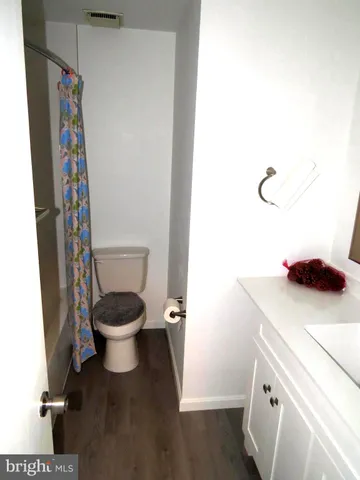 a bathroom with a toilet and a sink