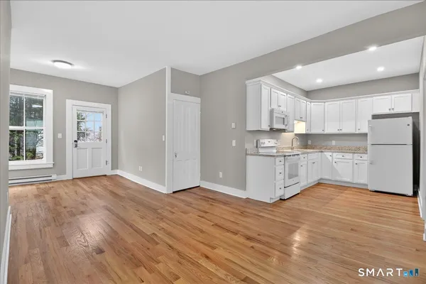a view of kitchen with wooden floor