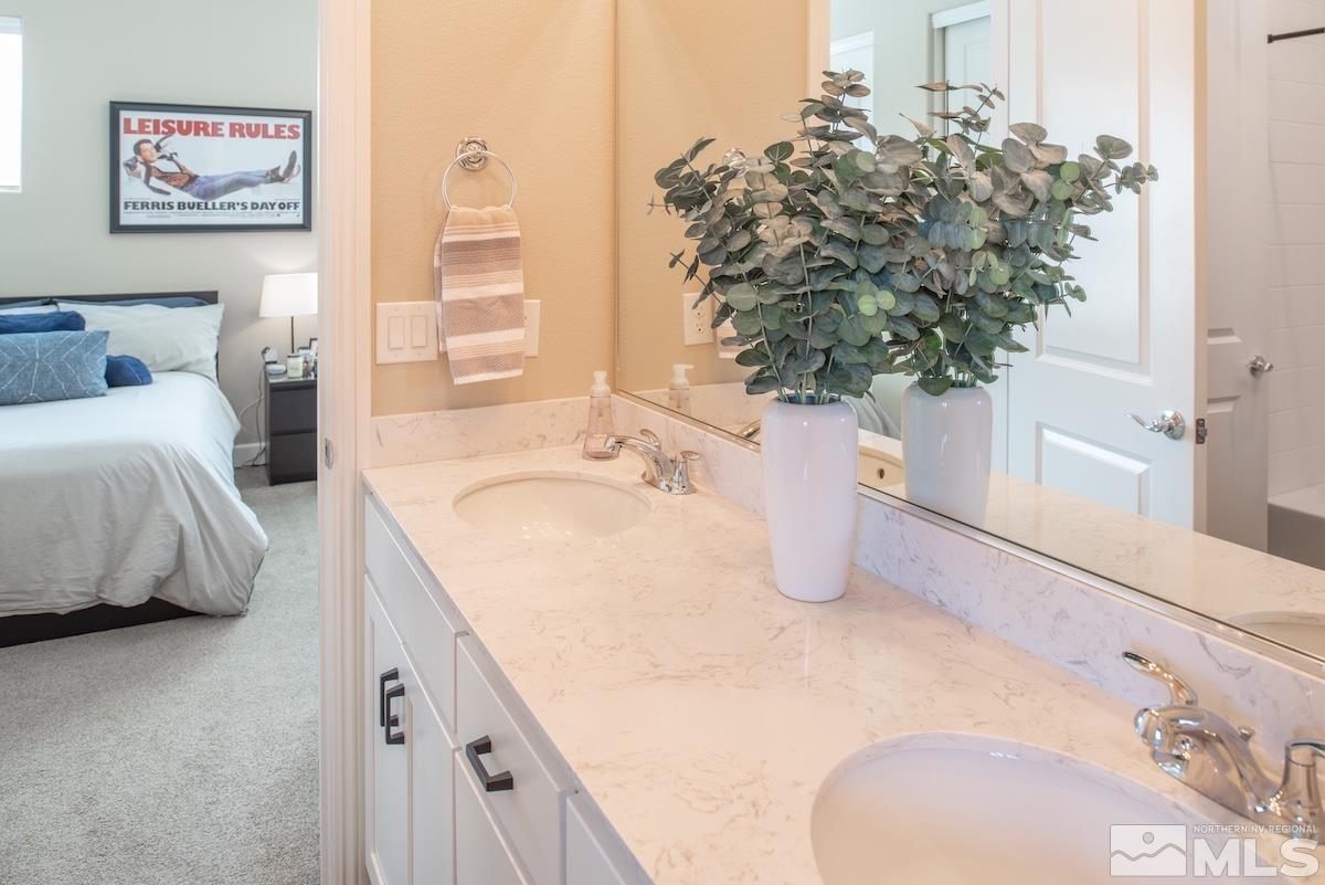 9865 Sea Breeze Lane Reno, NV 89521 - Photo 22 of 36 a bathroom with a tub sink and mirror