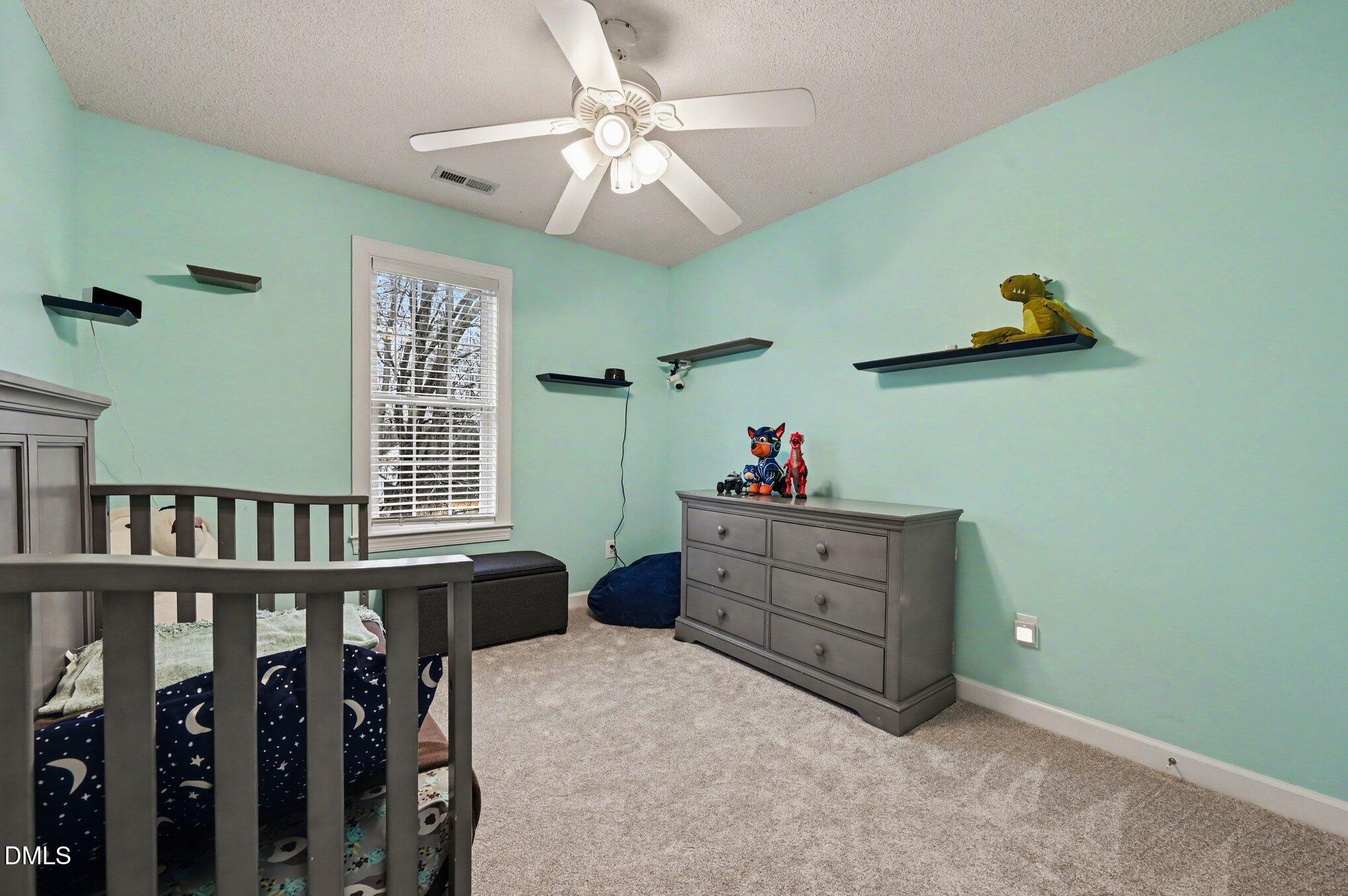 205 Weathervane Way Holly Springs, NC 27540 - Photo 13 of 25 a room with furniture and window