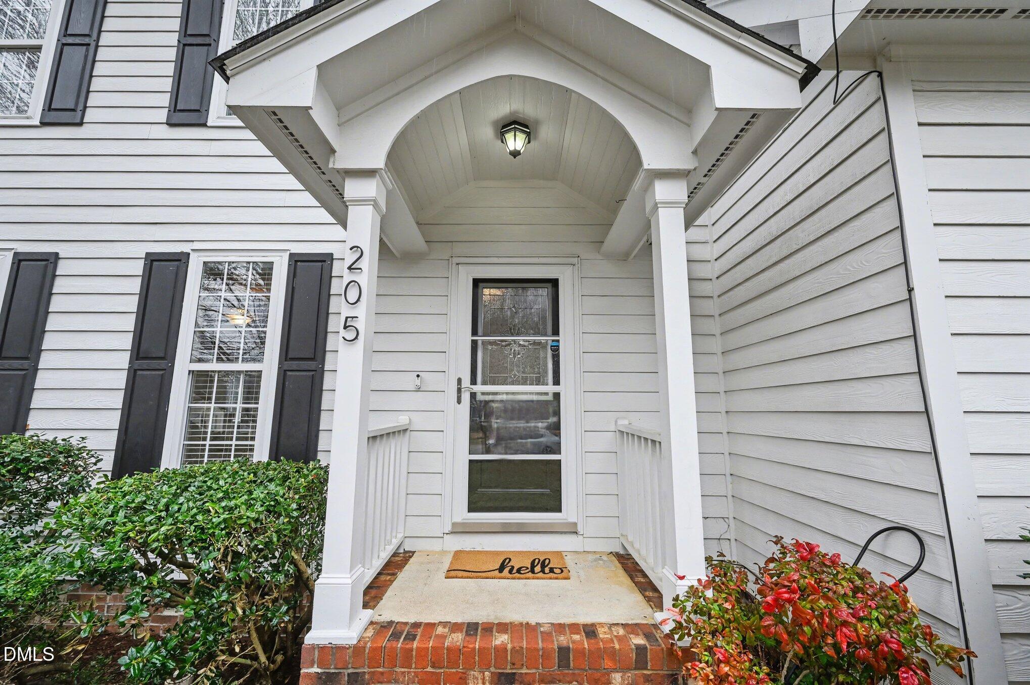 205 Weathervane Way Holly Springs, NC 27540 - Photo 2 of 25 a front view of a house with a yard