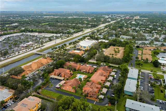 an aerial view of residential houses with outdoor space