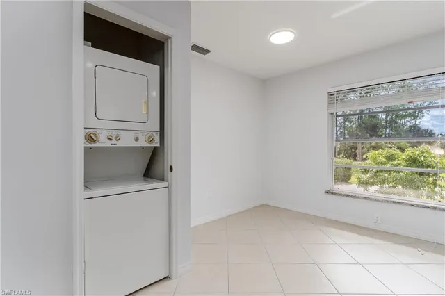 a view of a storage & utility room with a sink