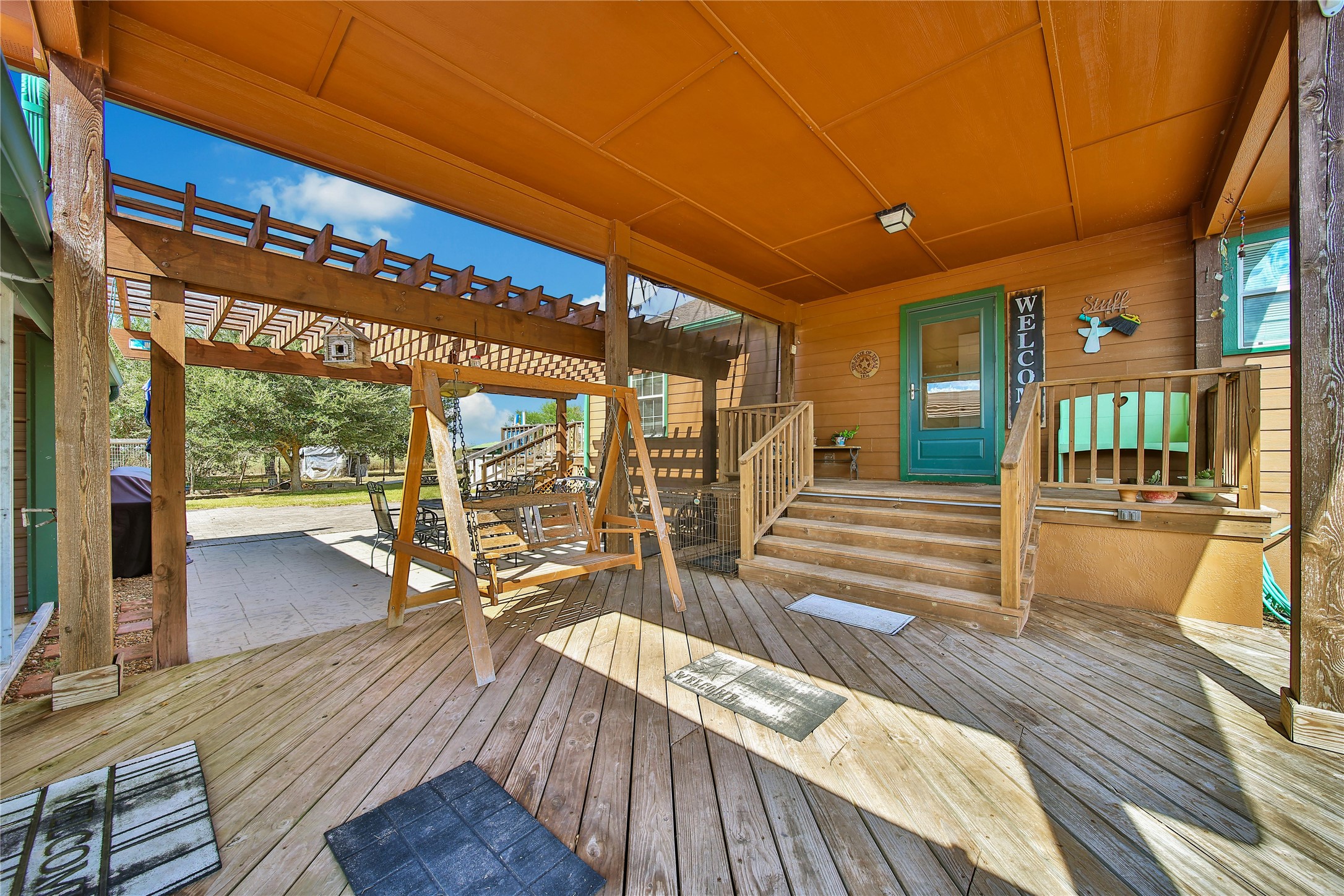 6151 West Creek Road East Bernard, TX 77435 - Photo 11 of 48 a view of a patio with wooden floor and iron stairs