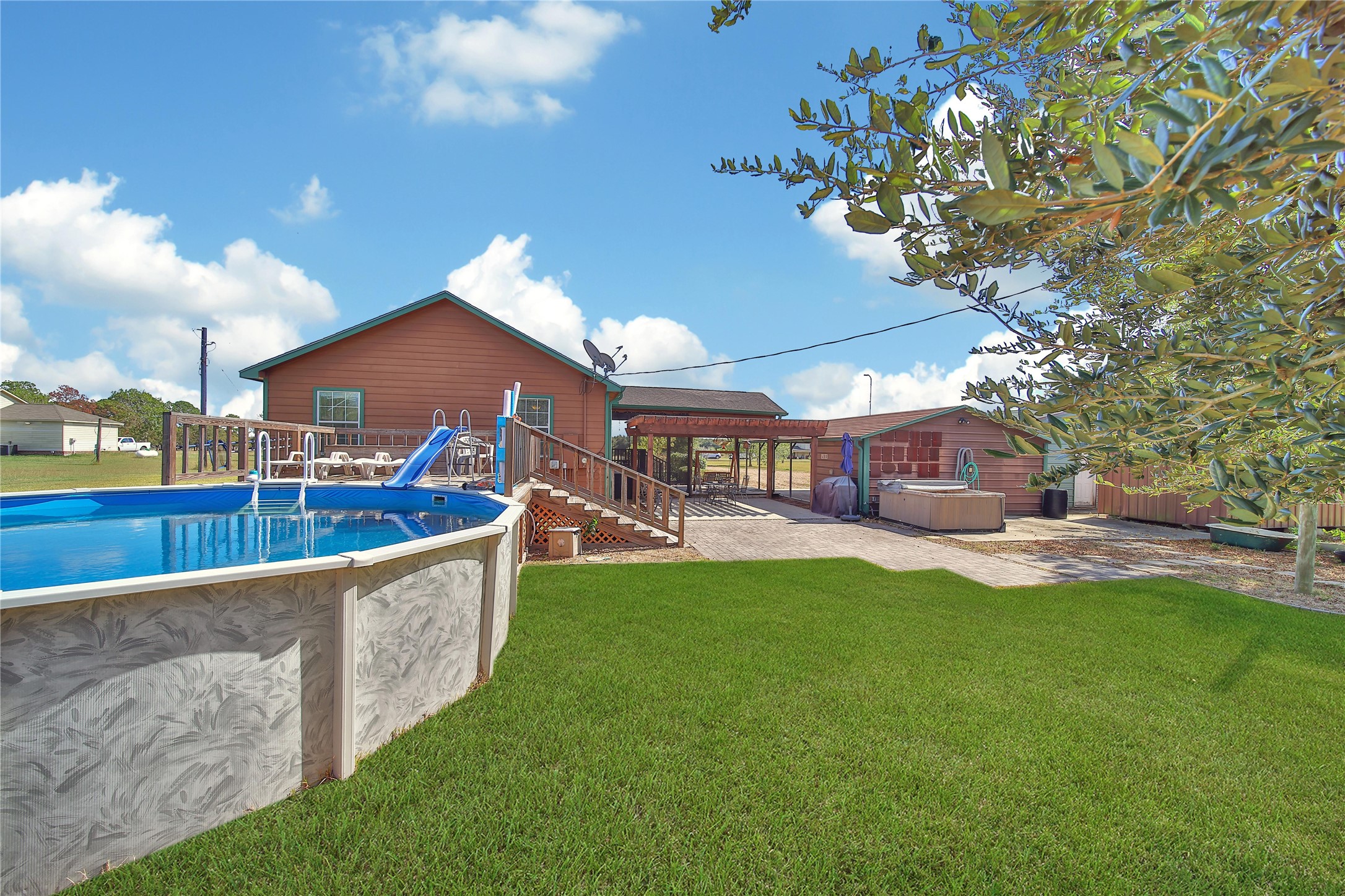 6151 West Creek Road East Bernard, TX 77435 - Photo 17 of 48 a view of a house with a yard porch and sitting area