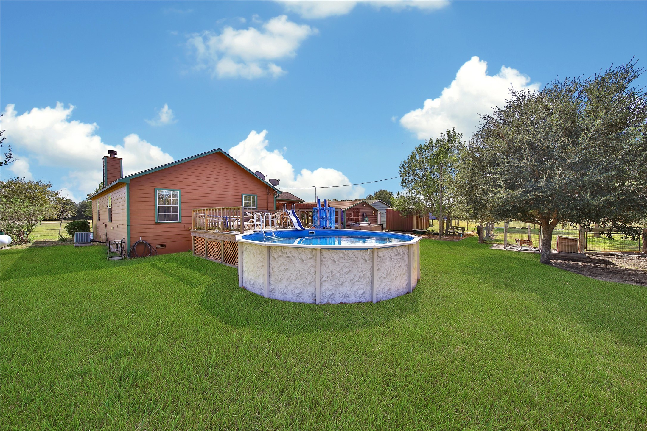6151 West Creek Road East Bernard, TX 77435 - Photo 18 of 48 a view of a backyard with a garden and entertaining space