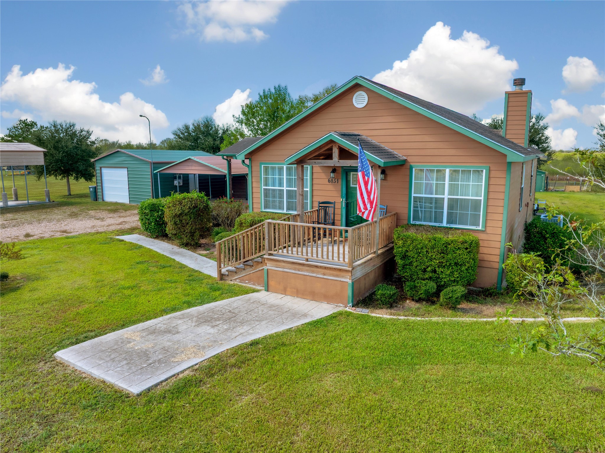 6151 West Creek Road East Bernard, TX 77435 - Photo 2 of 48 a front view of a house with a yard and garage