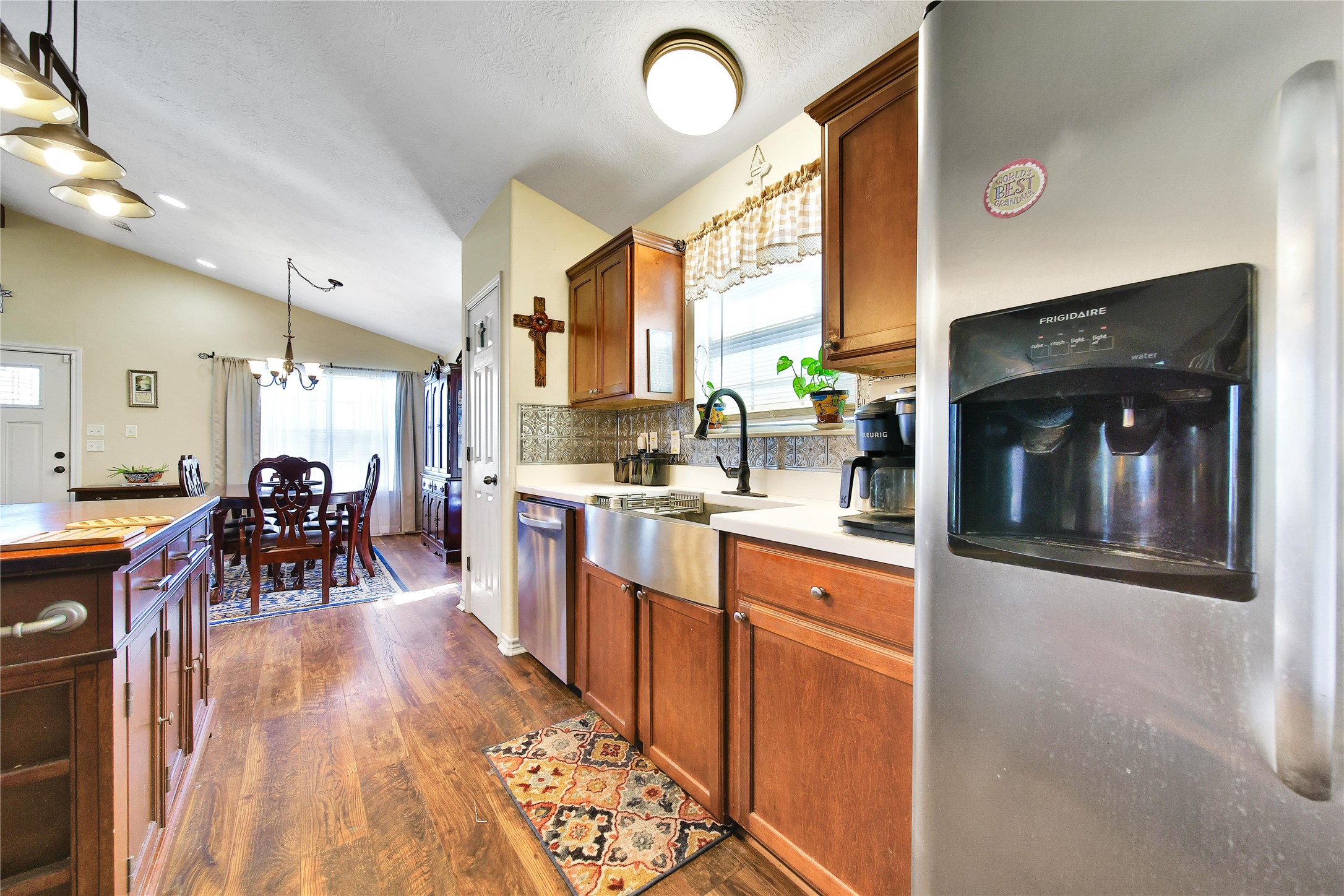 6151 West Creek Road East Bernard, TX 77435 - Photo 28 of 48 a kitchen with stainless steel appliances granite countertop sink stove refrigerator dining table and chairs