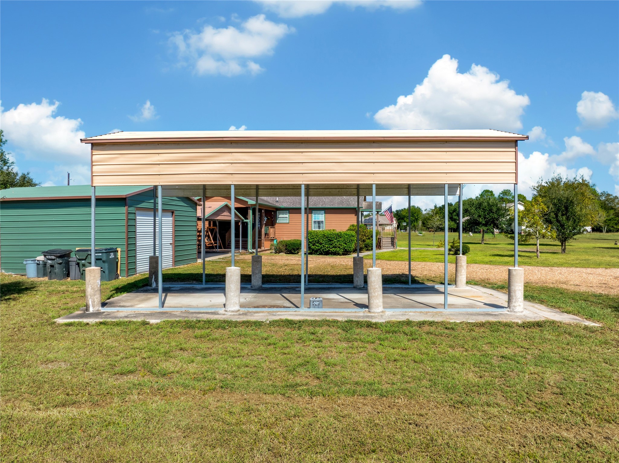 6151 West Creek Road East Bernard, TX 77435 - Photo 47 of 48 a view of a house with backyard and sitting area