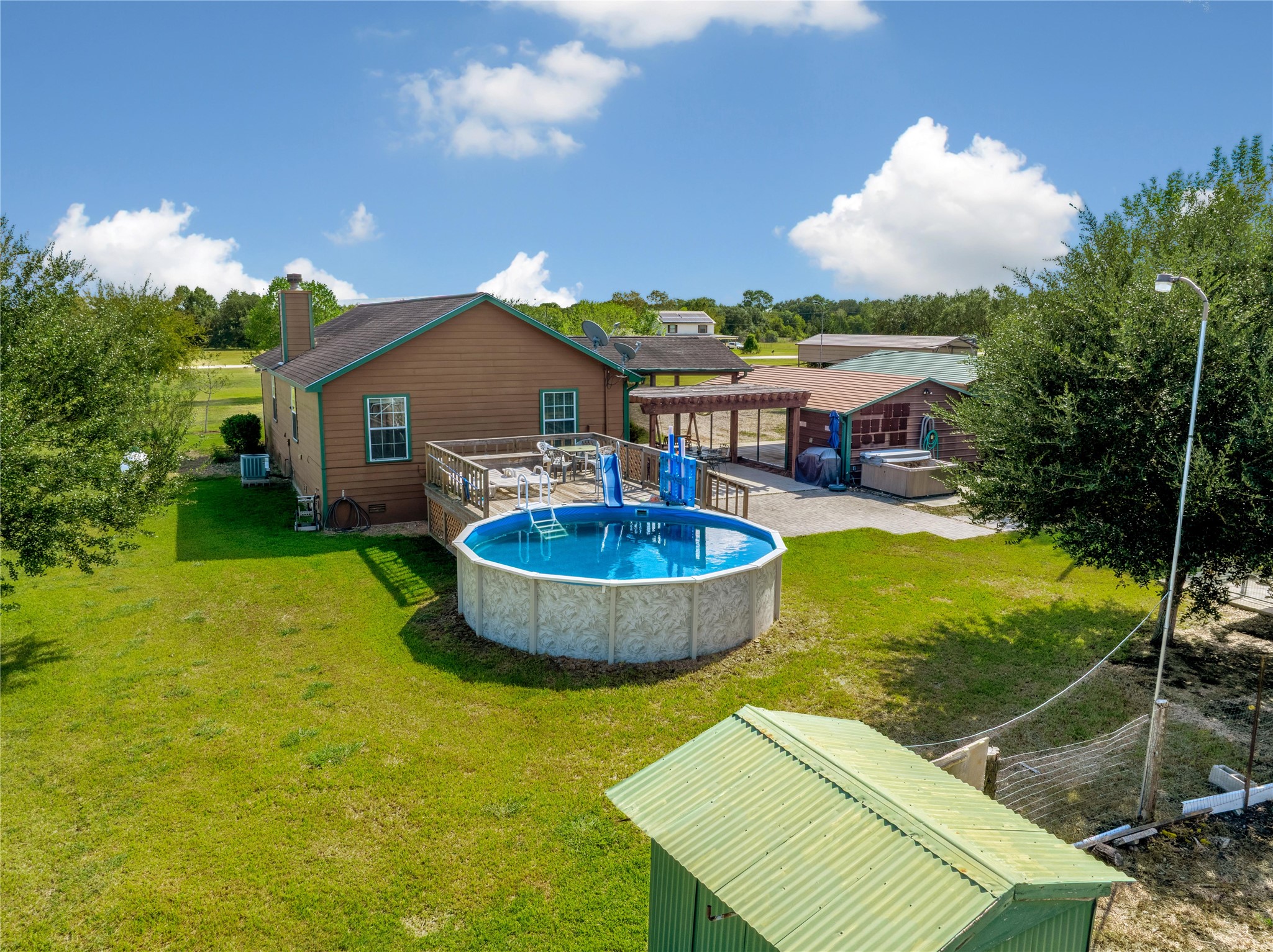 6151 West Creek Road East Bernard, TX 77435 - Photo 48 of 48 a view of a swimming pool with a yard