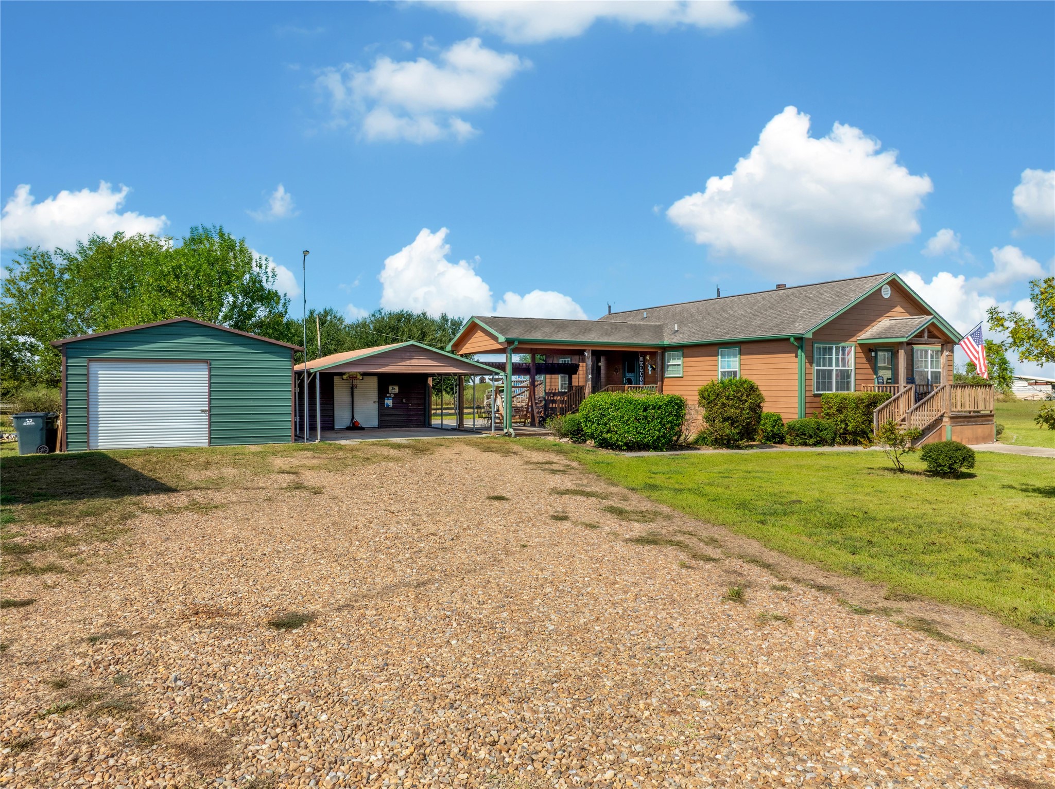 6151 West Creek Road East Bernard, TX 77435 - Photo 6 of 48 a front view of a house with a garden