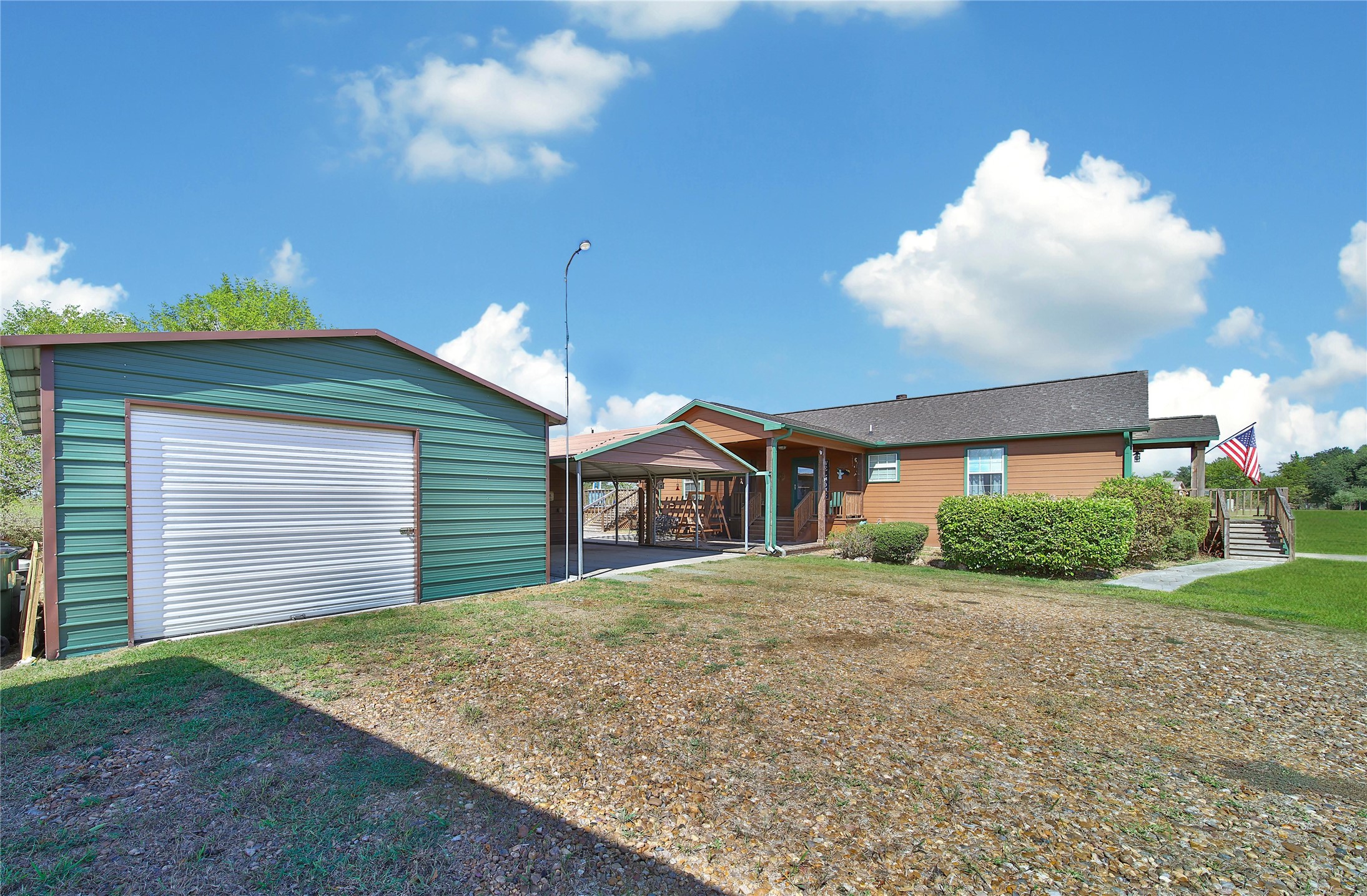 6151 West Creek Road East Bernard, TX 77435 - Photo 7 of 48 a front view of a house with a yard and garage