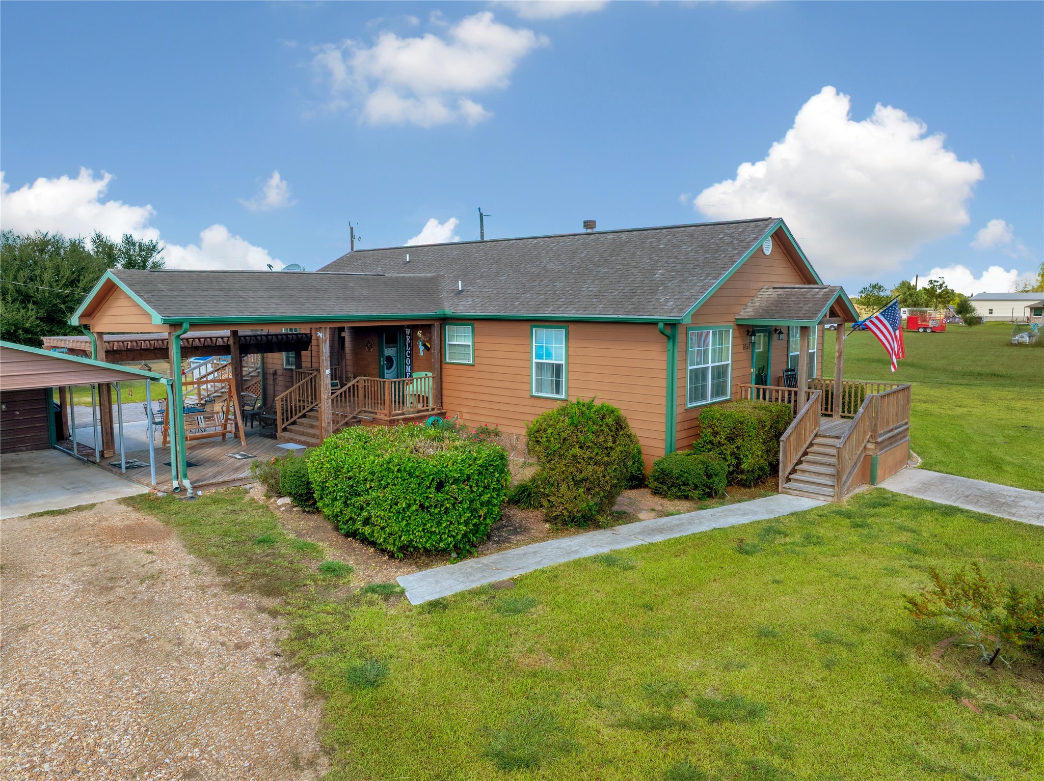 6151 West Creek Road East Bernard, TX 77435 - Photo 8 of 48 a front view of a house with garden