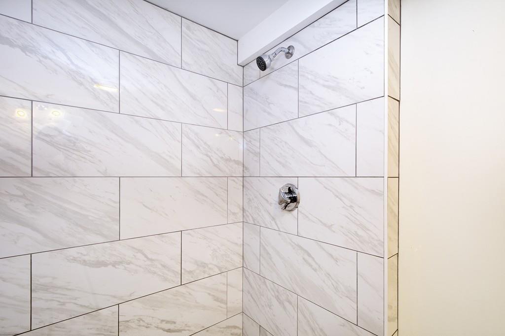 128 Washington Street, Unit R Hanover, MA 02339 - Photo 15 of 29 a bathroom with a shower