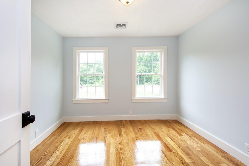 128 Washington Street, Unit R Hanover, MA 02339 - Photo 20 of 29 a view of an empty room with a window