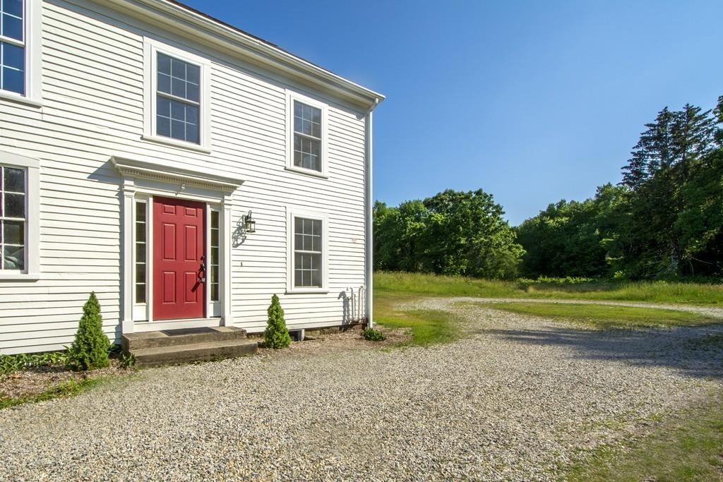 128 Washington Street, Unit R Hanover, MA 02339 - Photo 27 of 29 a front view of a house with a yard