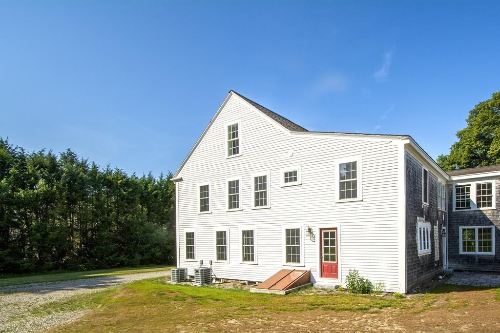 128 Washington Street, Unit R Hanover, MA 02339 - Photo 28 of 29 a front view of a house with a yard