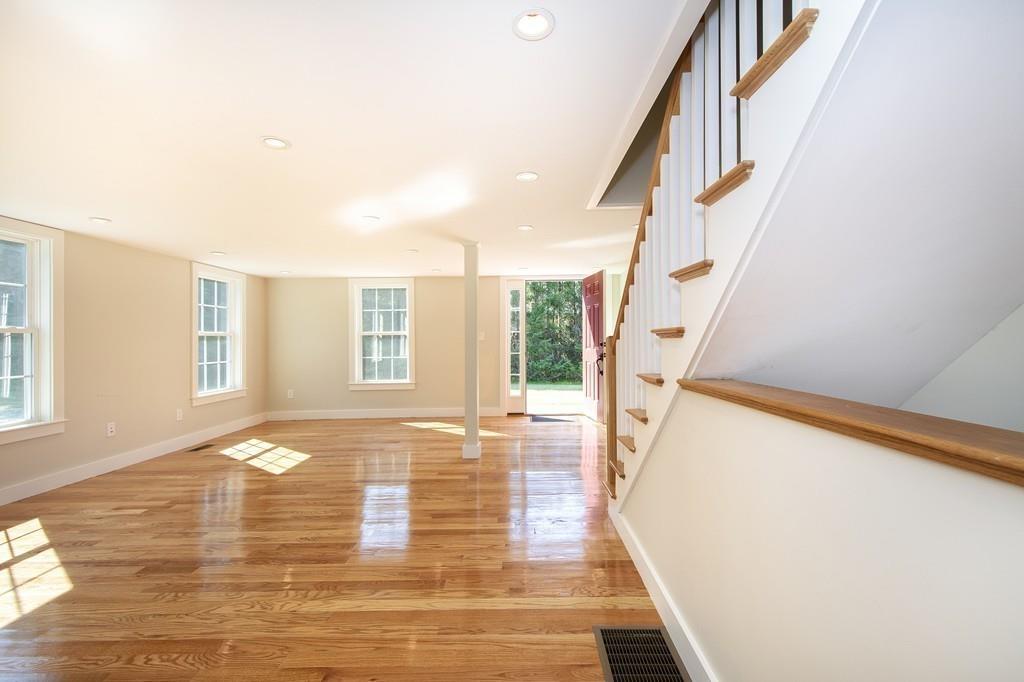 128 Washington Street, Unit R Hanover, MA 02339 - Photo 6 of 29 a view of an entryway with wooden floor and stairs