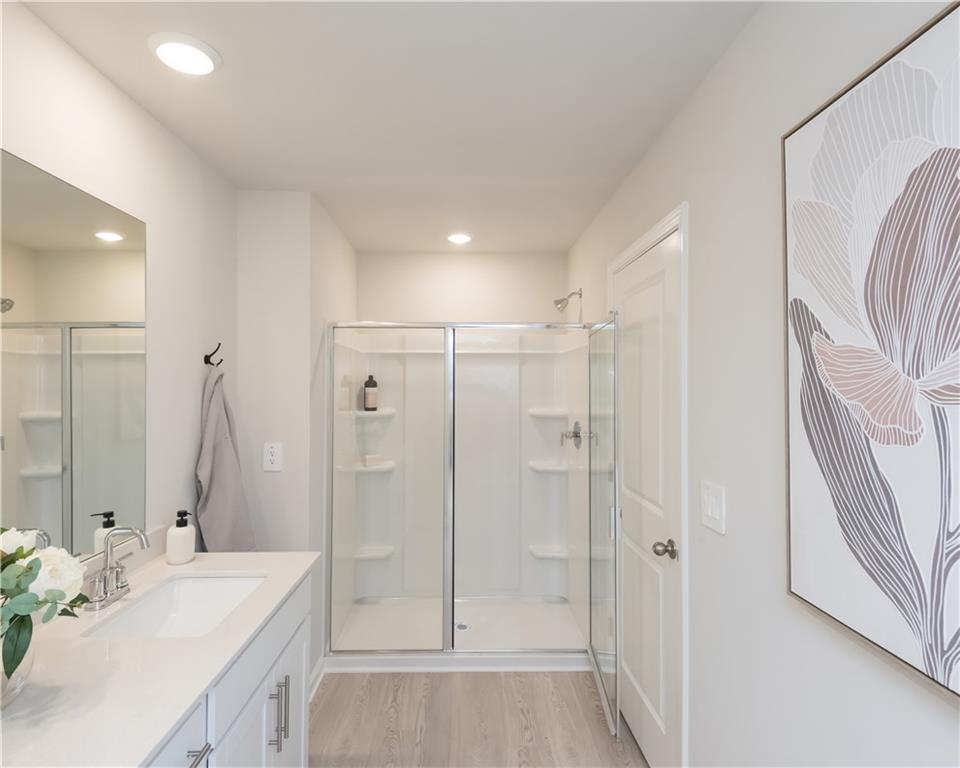 2246 Ashton Drive Conyers, GA 30013 - Photo 12 of 18 a bathroom with a sink a toilet and shower