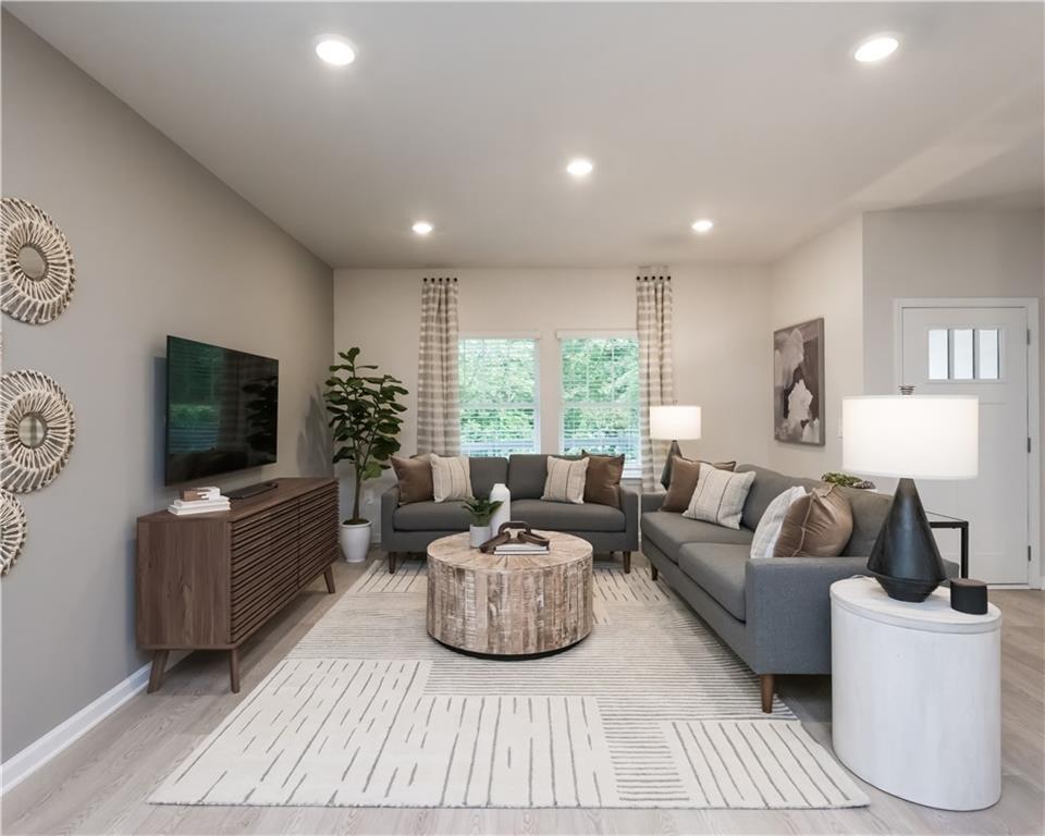 2246 Ashton Drive Conyers, GA 30013 - Photo 8 of 18 a living room with furniture and a flat screen tv