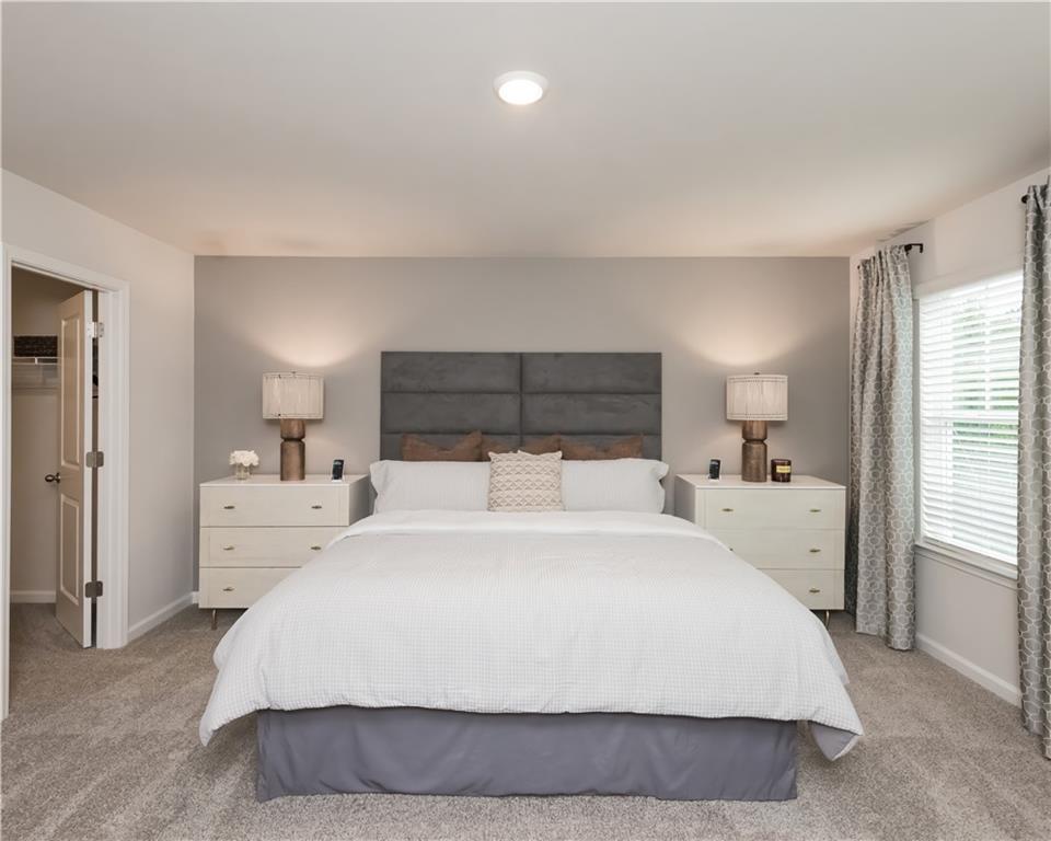 2246 Ashton Drive Conyers, GA 30013 - Photo 10 of 18 a large white bed in a white room