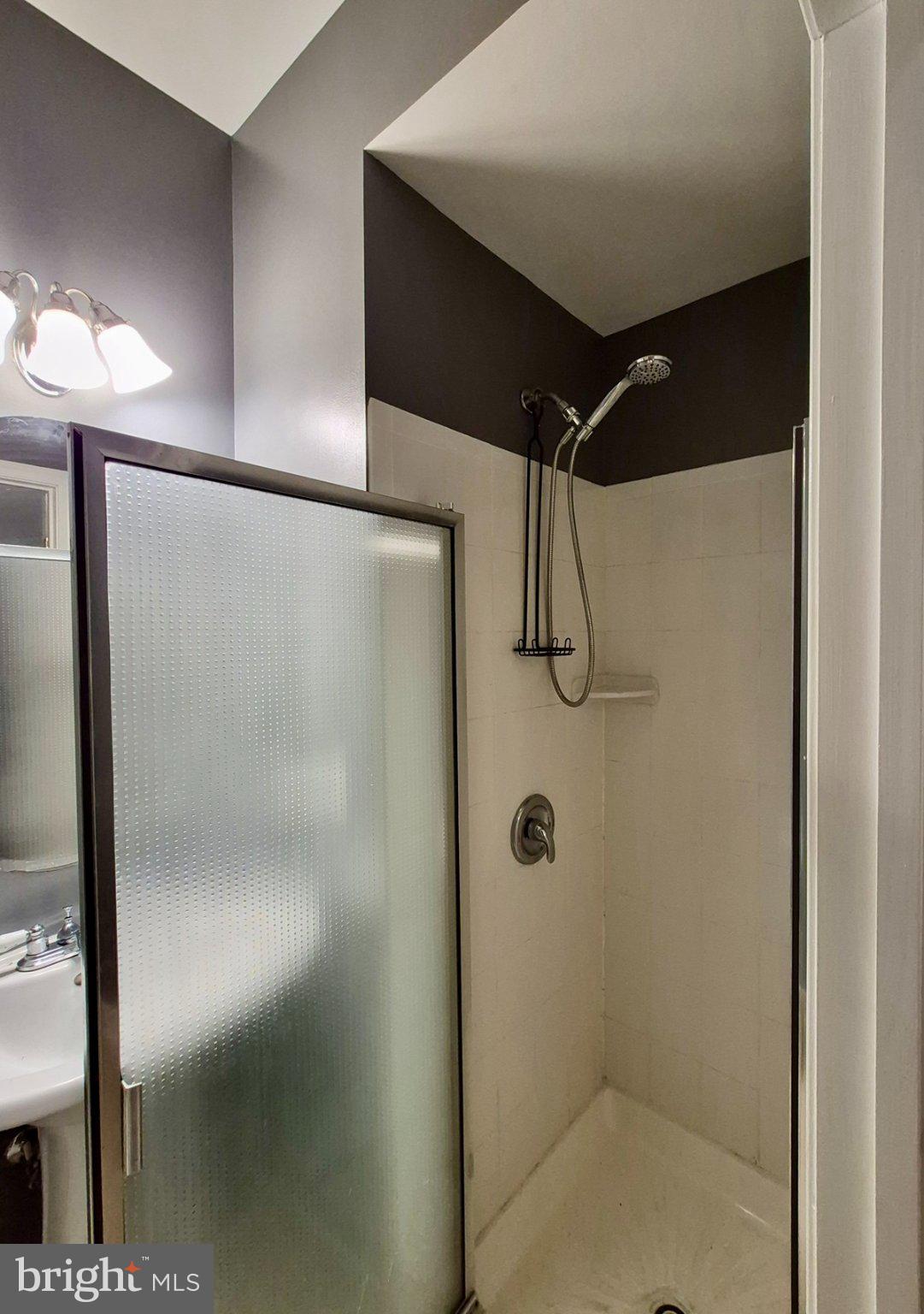 2126 Little Sorrel Way Silver Spring, MD 20902 - Photo 13 of 15 Sleek modern shower with glass doors.