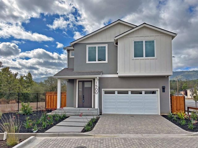 a front view of a house with a garage