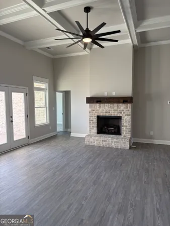 a kitchen with stainless steel appliances granite countertop a sink a stove and a wooden floor
