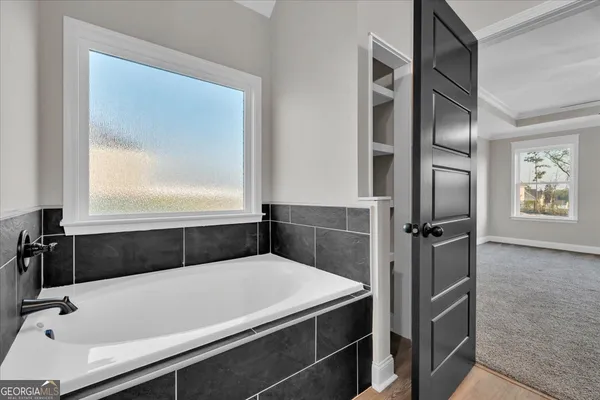 a view of a hallway with closet