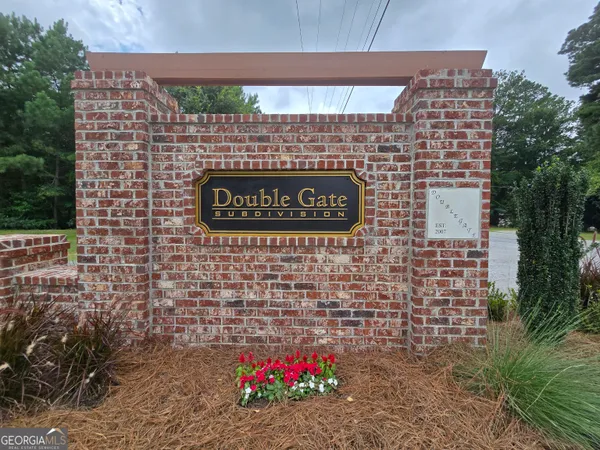 a view of kitchen with refrigerator and window