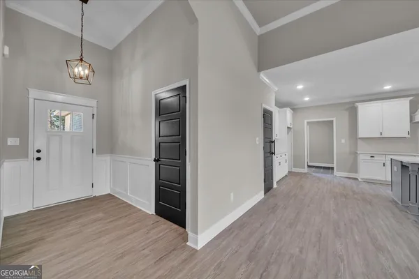 a view of a livingroom with a ceiling fan and window