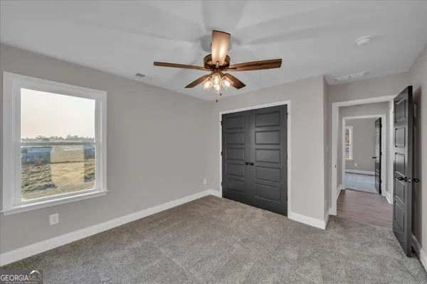 a view of a brick house with a large window