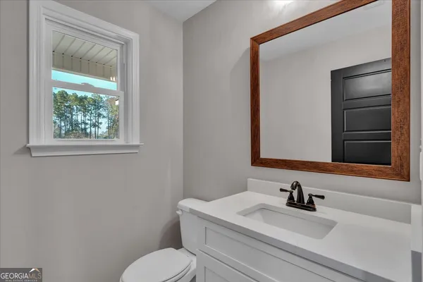 a view of a house with swimming pool and mountains in the background