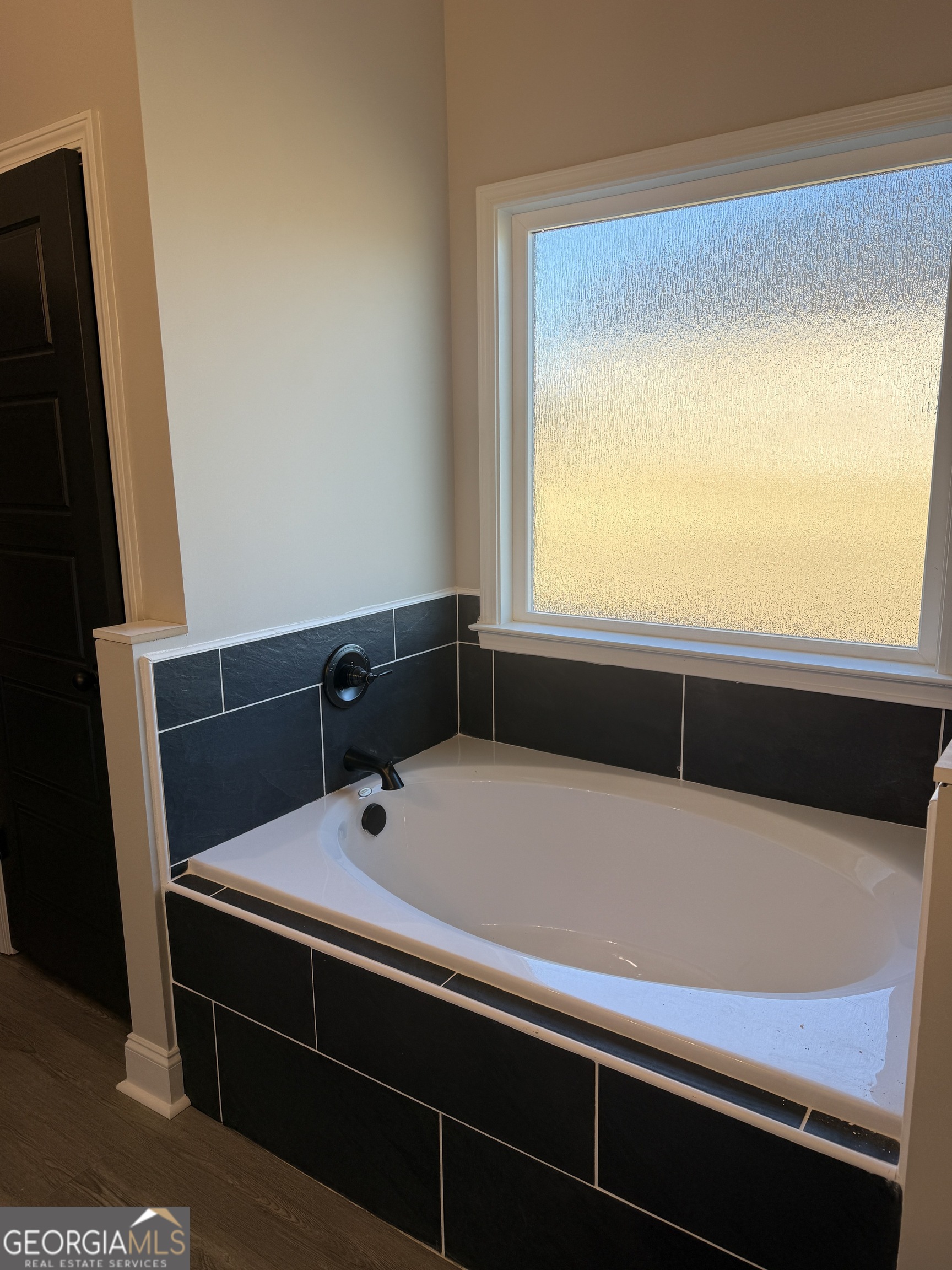 169 Doublegate Drive Lizella, GA 31052 - Photo 4 of 8 a bathroom with a sink and a bathtub