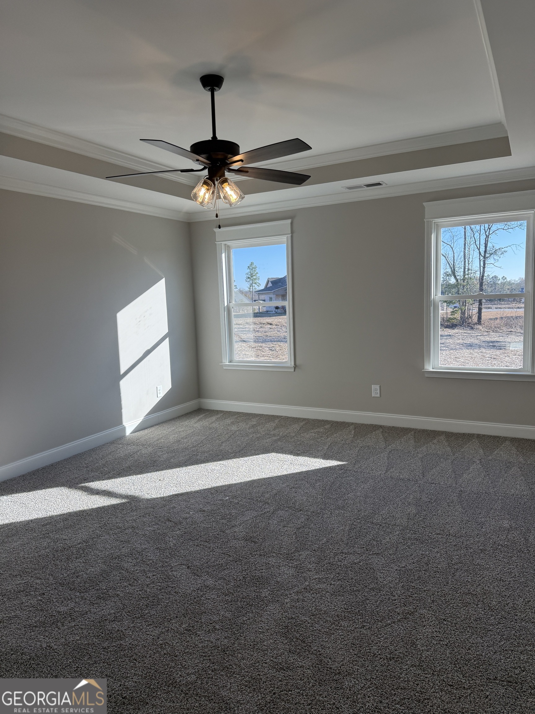 169 Doublegate Drive Lizella, GA 31052 - Photo 5 of 8 a view of empty room with windows