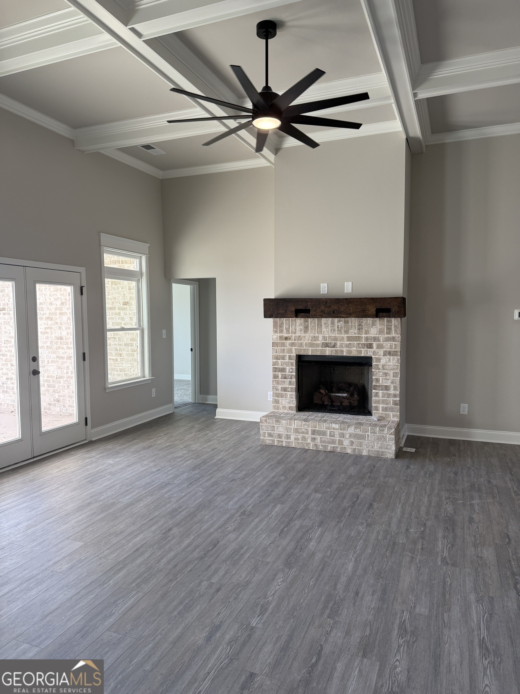 169 Doublegate Drive Lizella, GA 31052 - Photo 6 of 8 a view of an empty room with a fireplace and a window