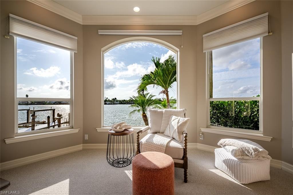 1942 Kingfish Road Naples, FL 34102 - Photo 24 of 43 a living room with furniture and a window