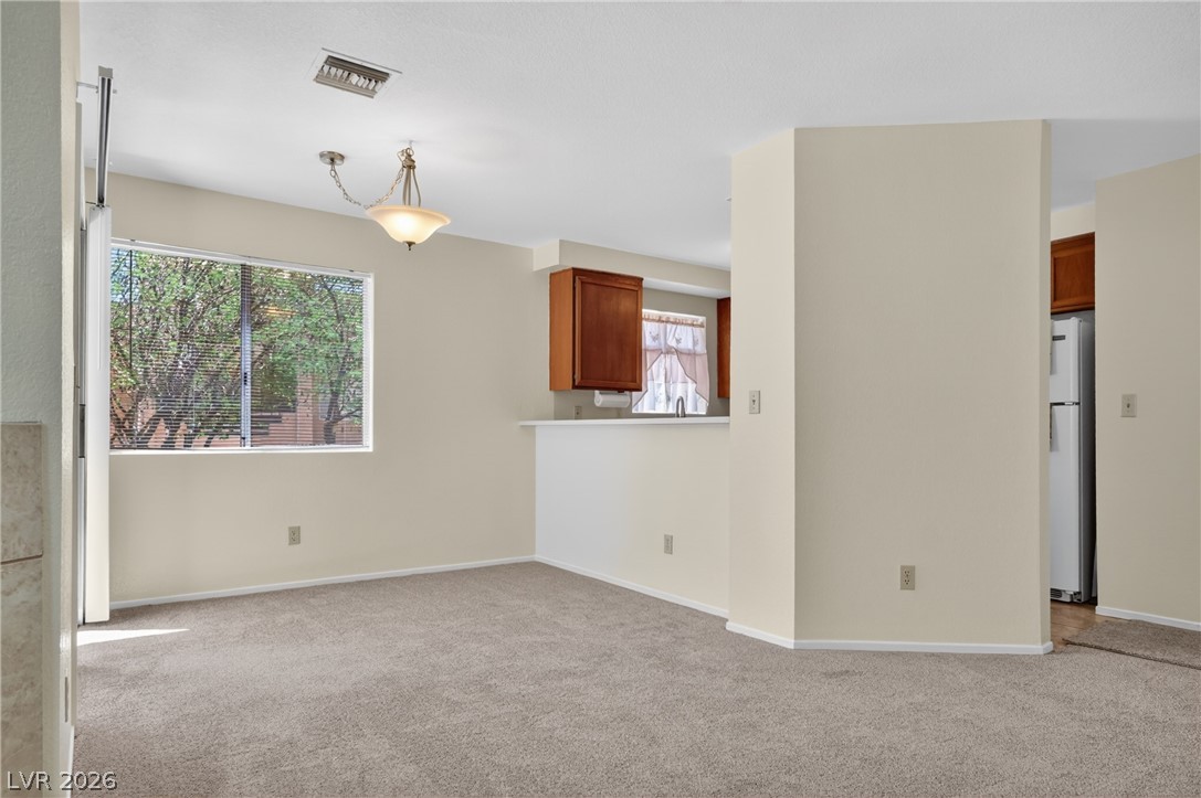 2241 Highpointe Drive, Unit 101 Laughlin, NV 89029 - Photo 7 of 23 This living space transitions seamlessly to the adjacent kitchen area.