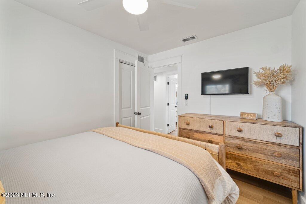 469 Skate Road Atlantic Beach, FL 32233 - Photo 26 of 40 a bedroom with a bed and a flat screen tv
