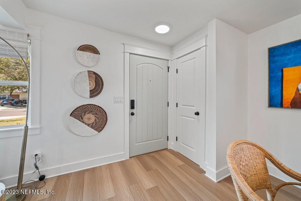 469 Skate Road Atlantic Beach, FL 32233 - Photo 3 of 40 a view of a room with wooden floor and windows