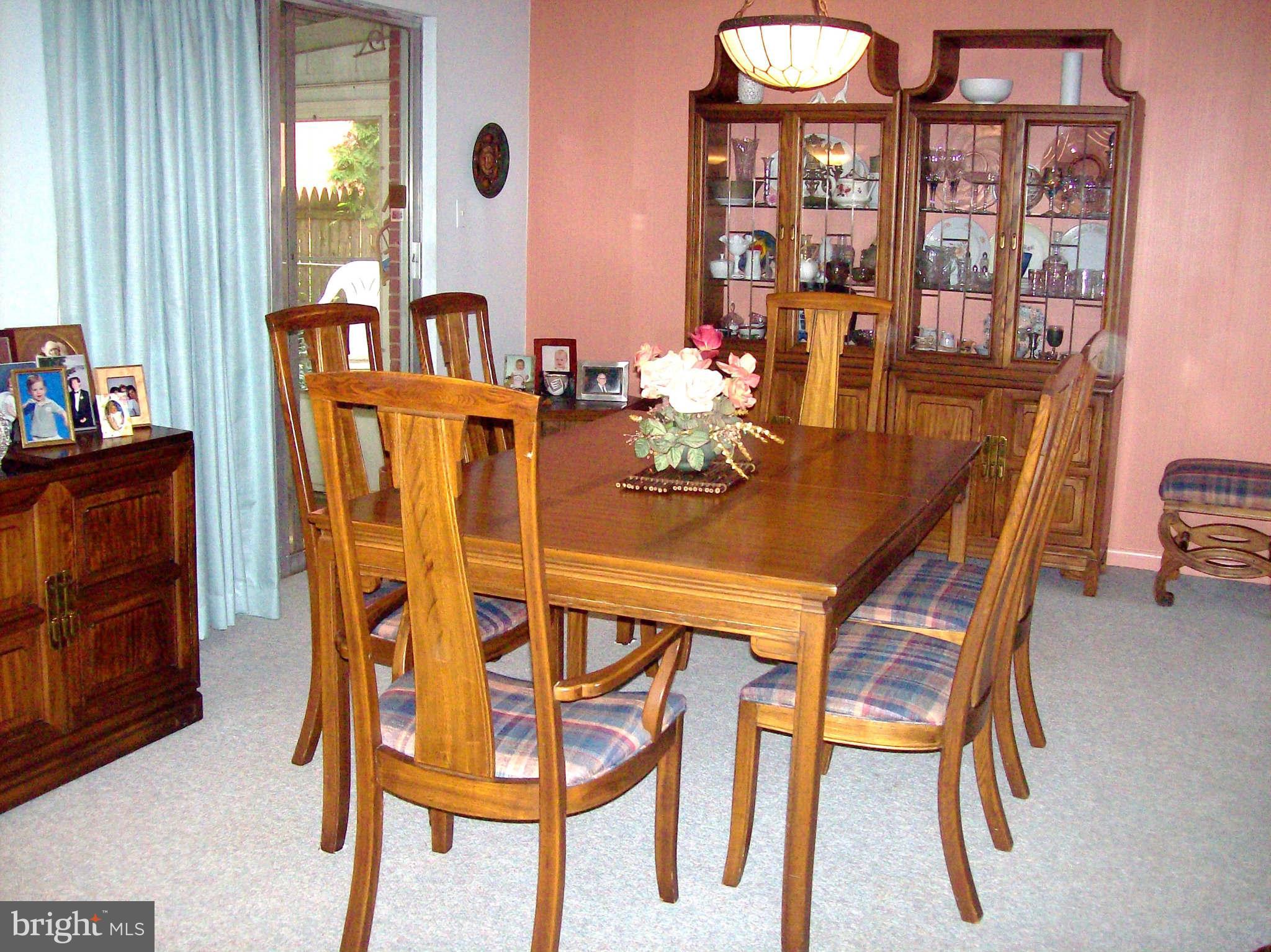 1010 Robroy Drive Silver Spring, MD 20903 - Photo 13 of 30 Elegant dining room leads to enclosed porch
