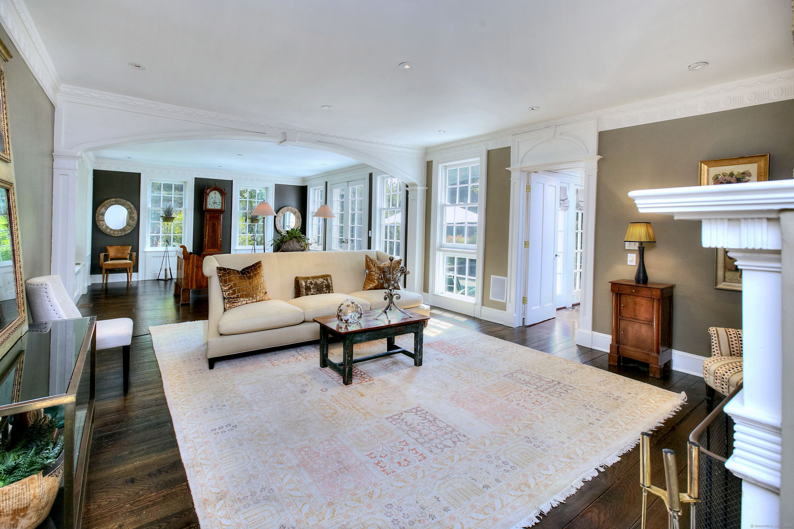 2683 Bronson Road Fairfield, CT 06824 - Photo 12 of 39 a living room with furniture and a fireplace
