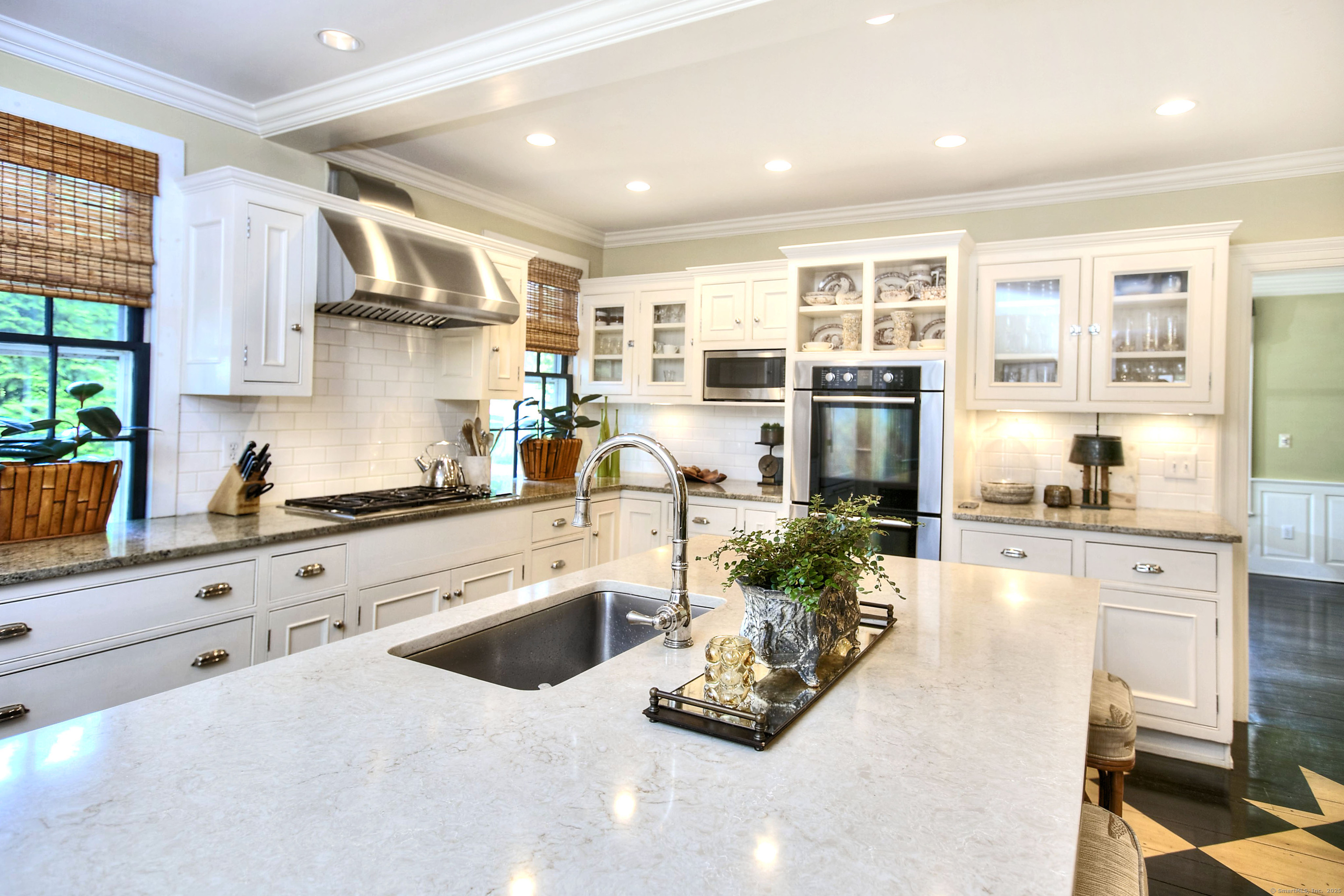 2683 Bronson Road Fairfield, CT 06824 - Photo 17 of 39 a kitchen with stainless steel appliances a stove a sink and a refrigerator