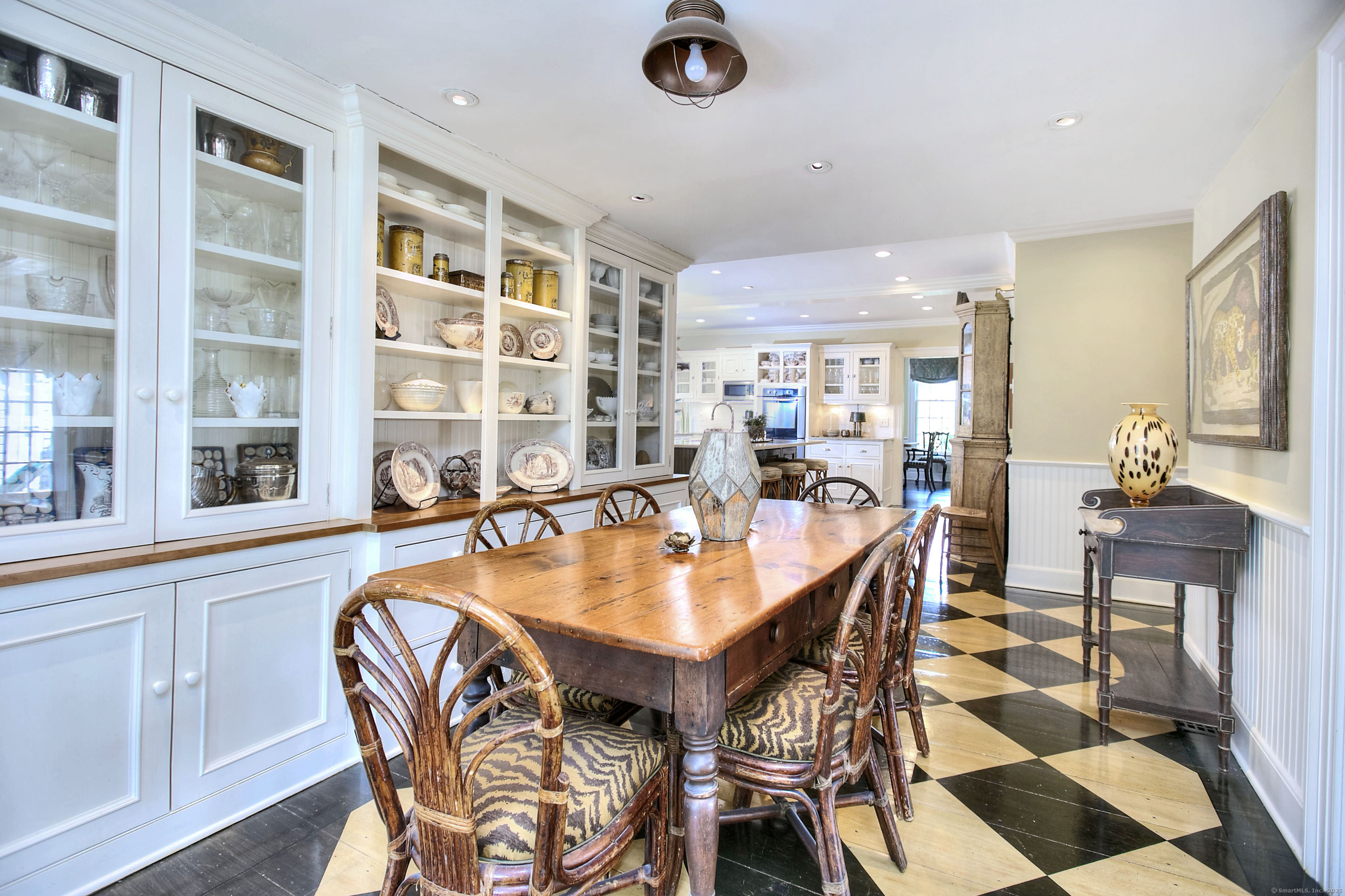 2683 Bronson Road Fairfield, CT 06824 - Photo 19 of 39 a dining room with a table and chairs