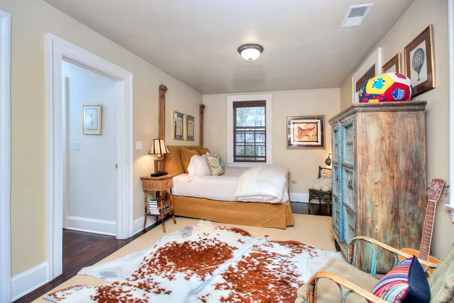 a bedroom with a bed and a couch