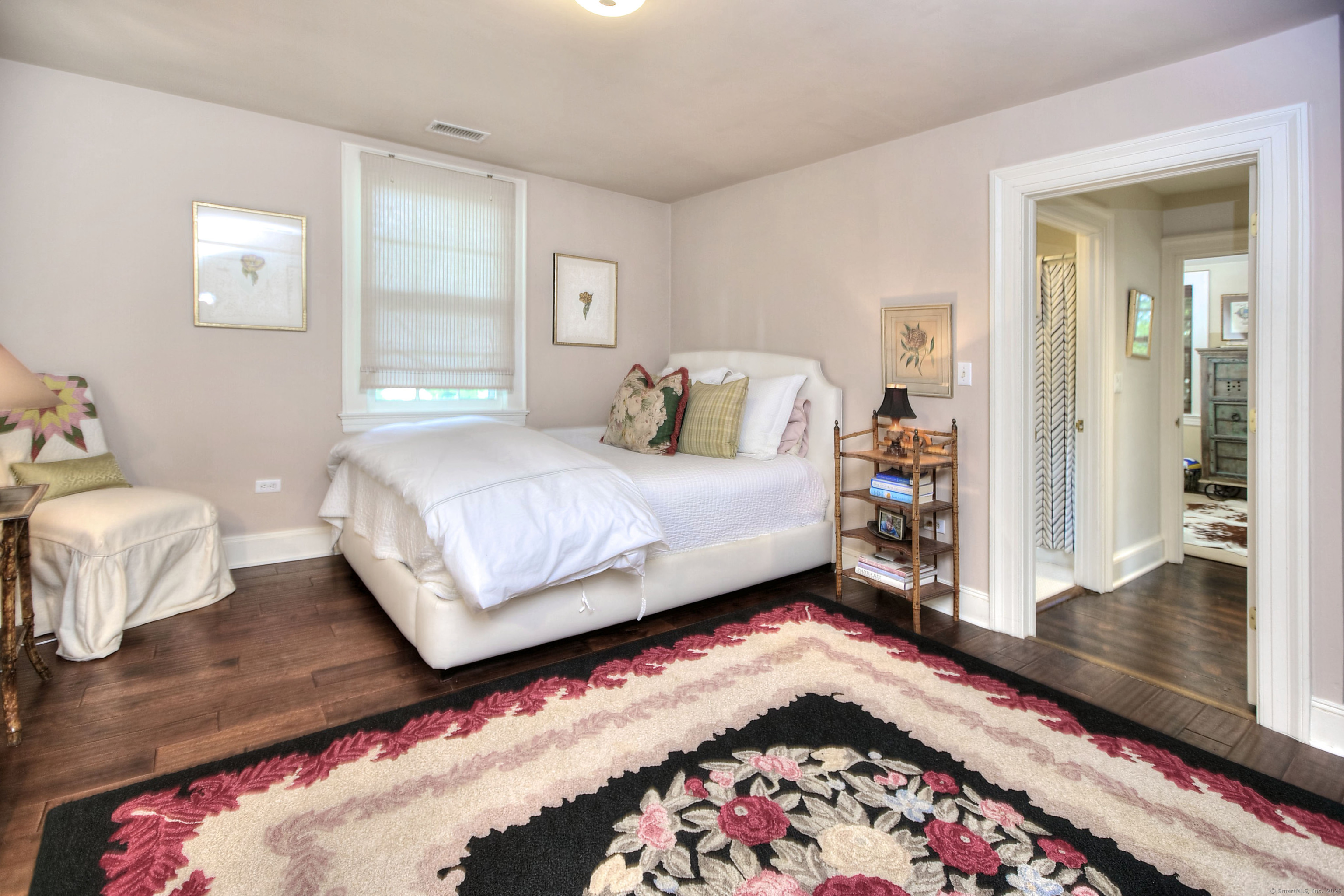 2683 Bronson Road Fairfield, CT 06824 - Photo 26 of 39 a bedroom with a bed and wooden floor